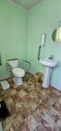 a bathroom with a toilet and a sink