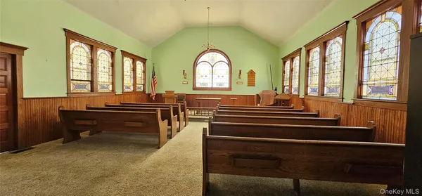 a sitting area with a large window