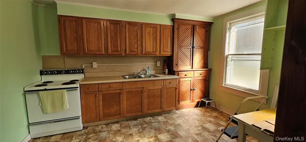a kitchen with stainless steel appliances granite countertop a refrigerator sink and cabinets