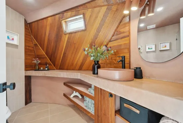 a view of a bathroom with a sink and a mirror