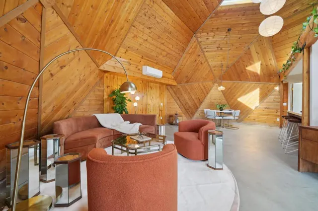 a view of a patio with table and chairs and couches