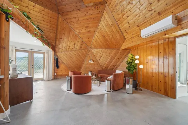 a view of a patio with iron fence