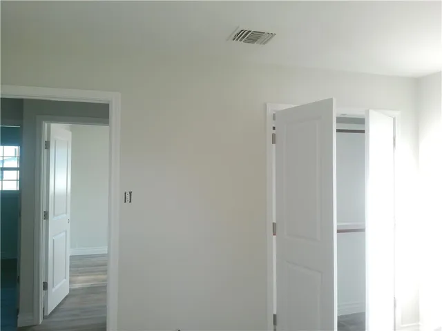 a view of a livingroom with wooden floor