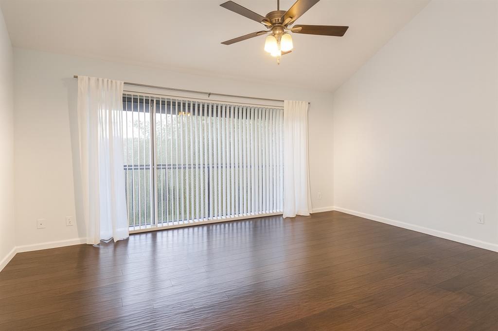 4561 O North O'Connor Road, Unit 1294 Irving, TX 75062 - Photo 11 of 31 an empty room with wooden floor fan and windows