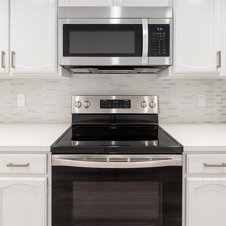 4561 O North O'Connor Road, Unit 1294 Irving, TX 75062 - Photo 18 of 31 a stove top oven sitting inside of a kitchen