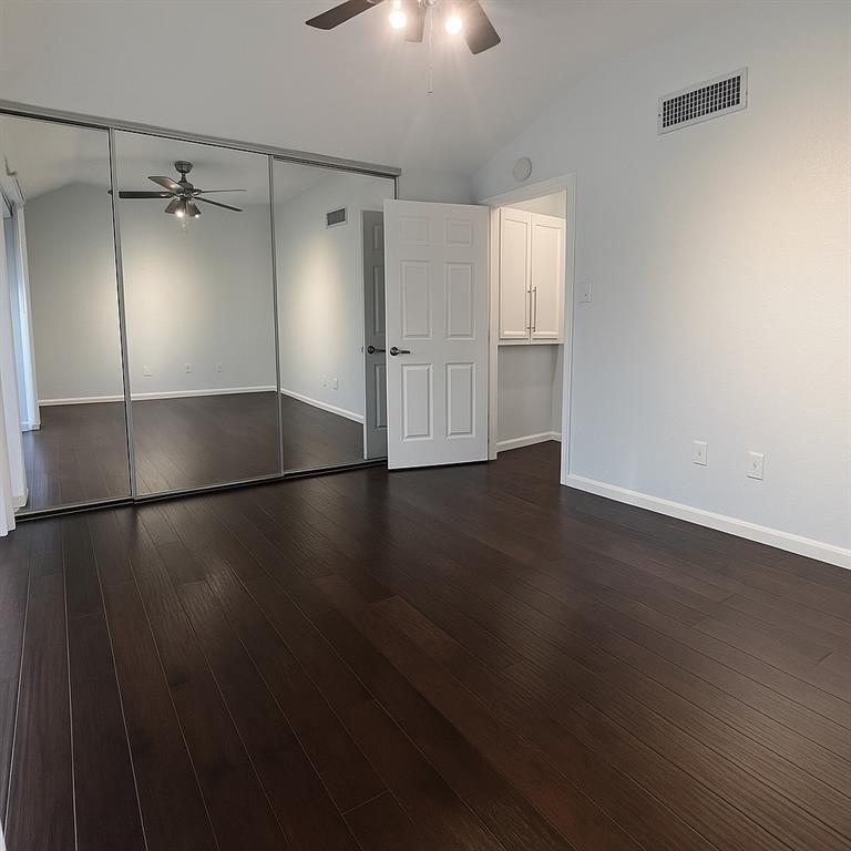 4561 O North O'Connor Road, Unit 1294 Irving, TX 75062 - Photo 20 of 31 an empty room with wooden floor and windows