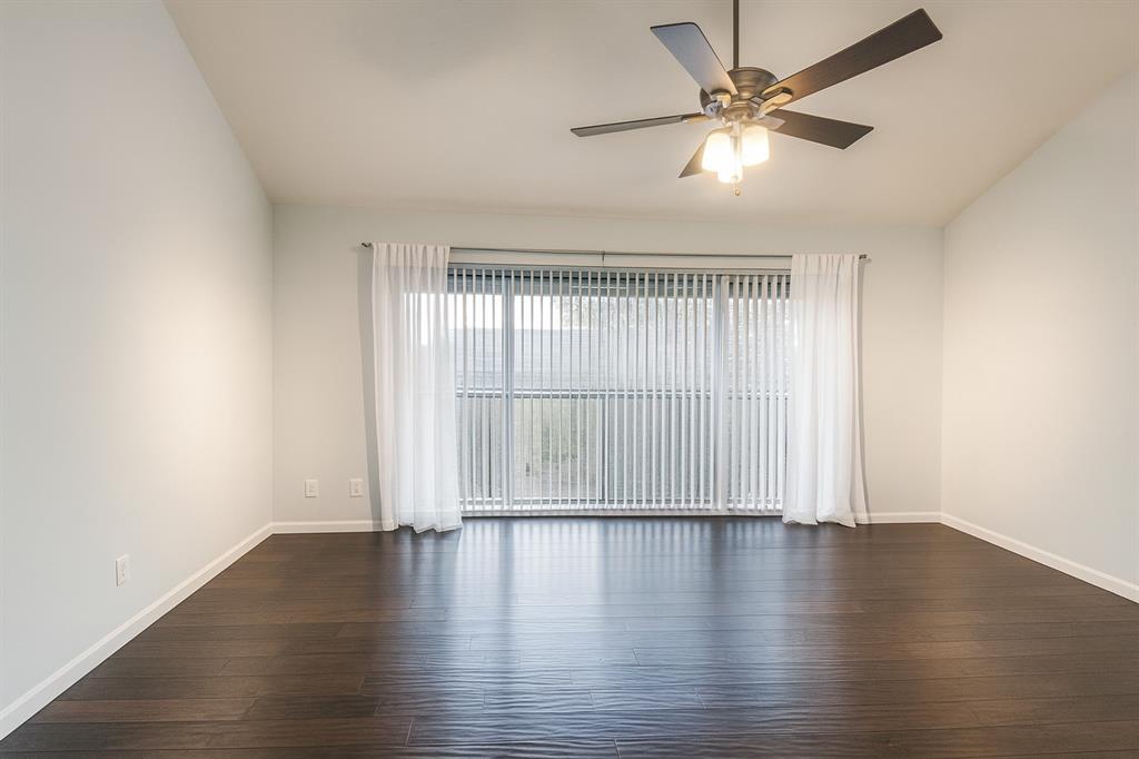 4561 O North O'Connor Road, Unit 1294 Irving, TX 75062 - Photo 22 of 31 wooden floor in an empty room with a window