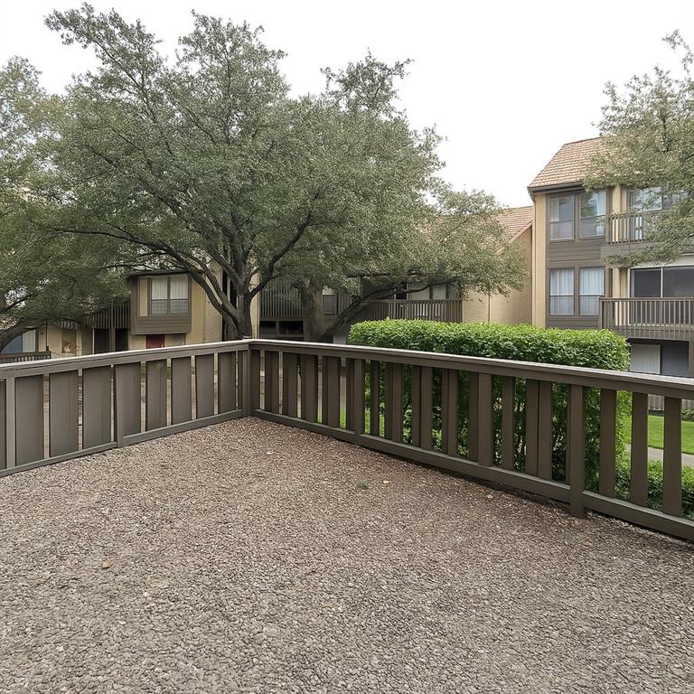 4561 O North O'Connor Road, Unit 1294 Irving, TX 75062 - Photo 26 of 31 a view of a house with a wooden fence