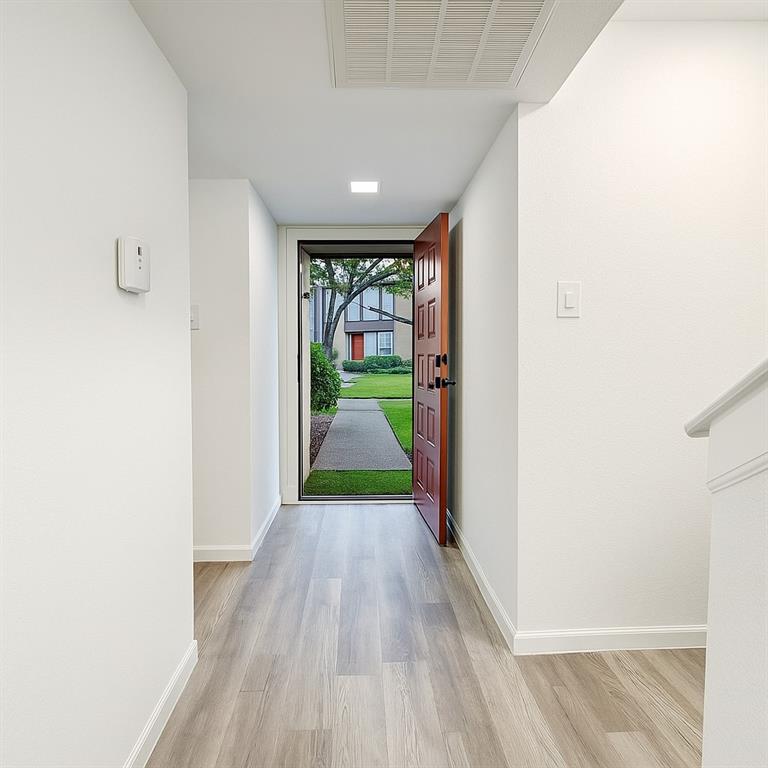 4561 O North O'Connor Road, Unit 1294 Irving, TX 75062 - Photo 5 of 31 a view of empty room with wooden floor and fan