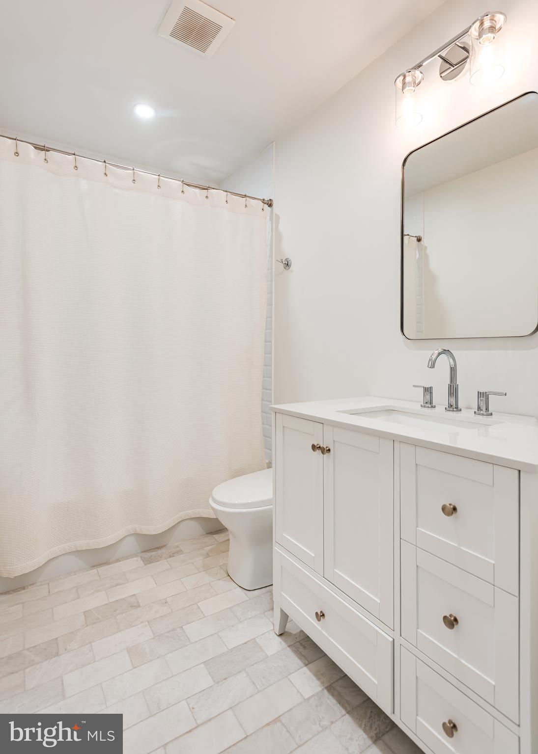 723 Saylors Mill Road Spring City, PA 19475 - Photo 37 of 74 a bathroom with a toilet sink and a mirror