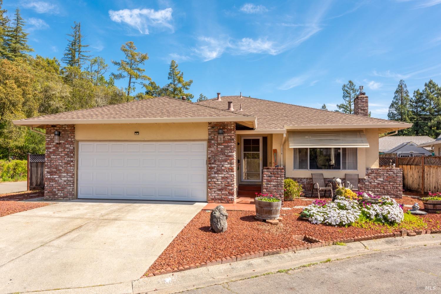 a front view of a house with yard