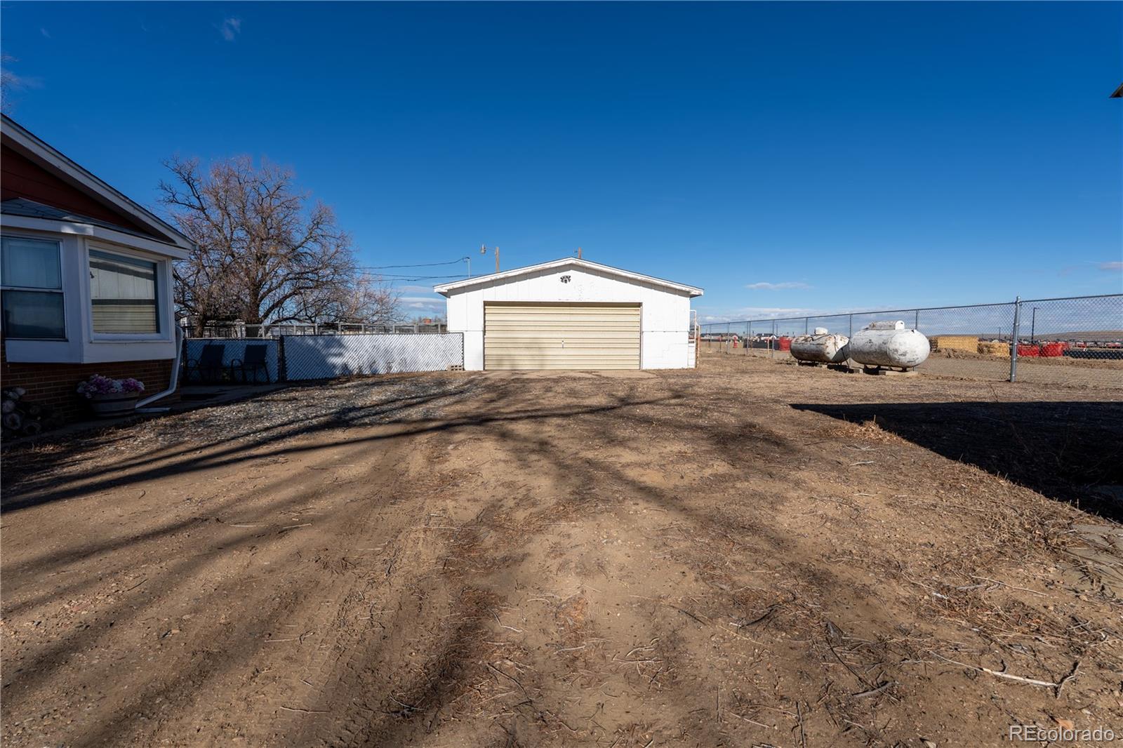 12169 East Baseline Road Lafayette, CO 80026 - Photo 28 of 39 a front view of a house with a yard