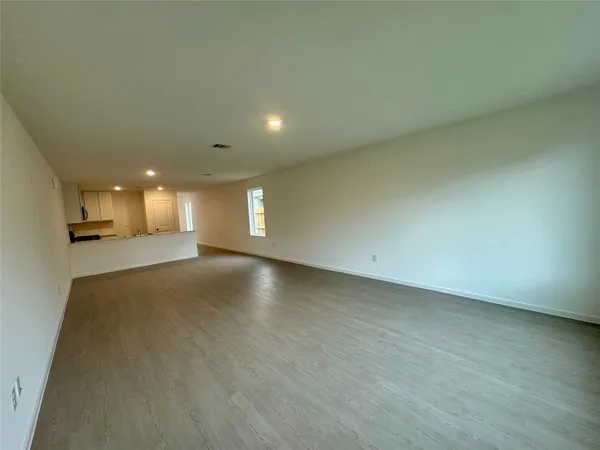 a bedroom with a bed and chair