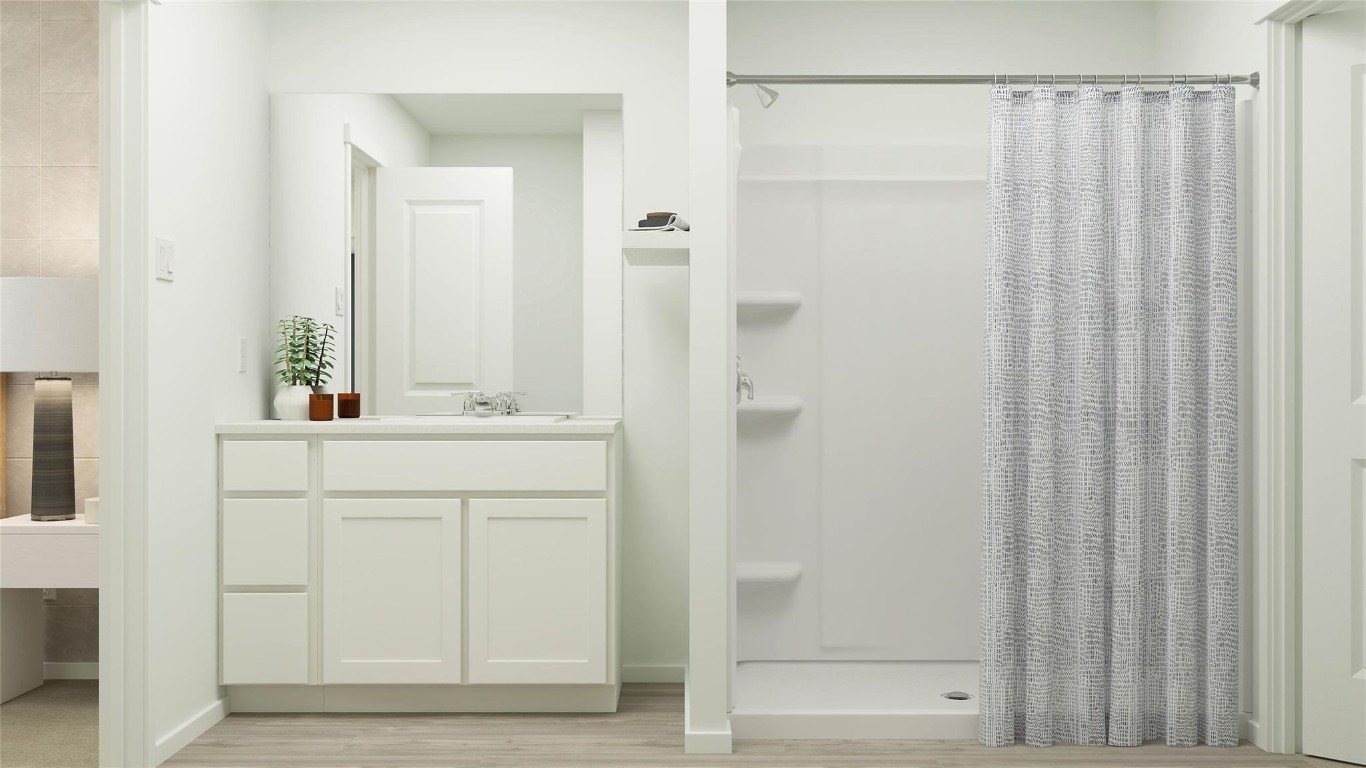 26710 Feather Reed Drive Katy, TX 77493 - Photo 9 of 10 a bathroom with a sink and a mirror