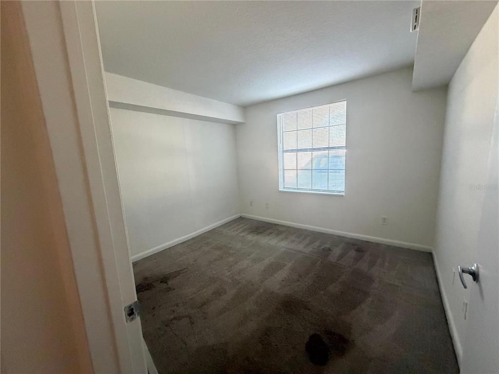 2323 McCoy Road, Unit 701 Orlando, FL 32809 - Photo 4 of 11 an empty room with a window