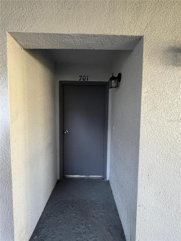 2323 McCoy Road, Unit 701 Orlando, FL 32809 - Photo 6 of 11 a view of a hallway