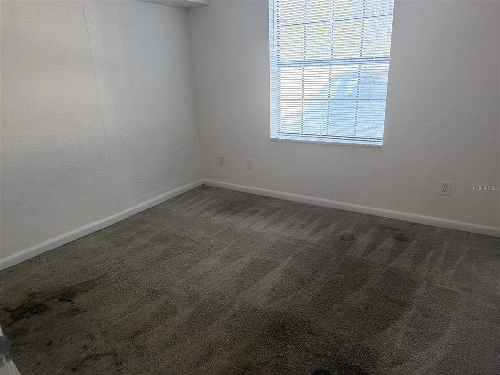 2323 McCoy Road, Unit 701 Orlando, FL 32809 - Photo 8 of 11 an empty room with a window