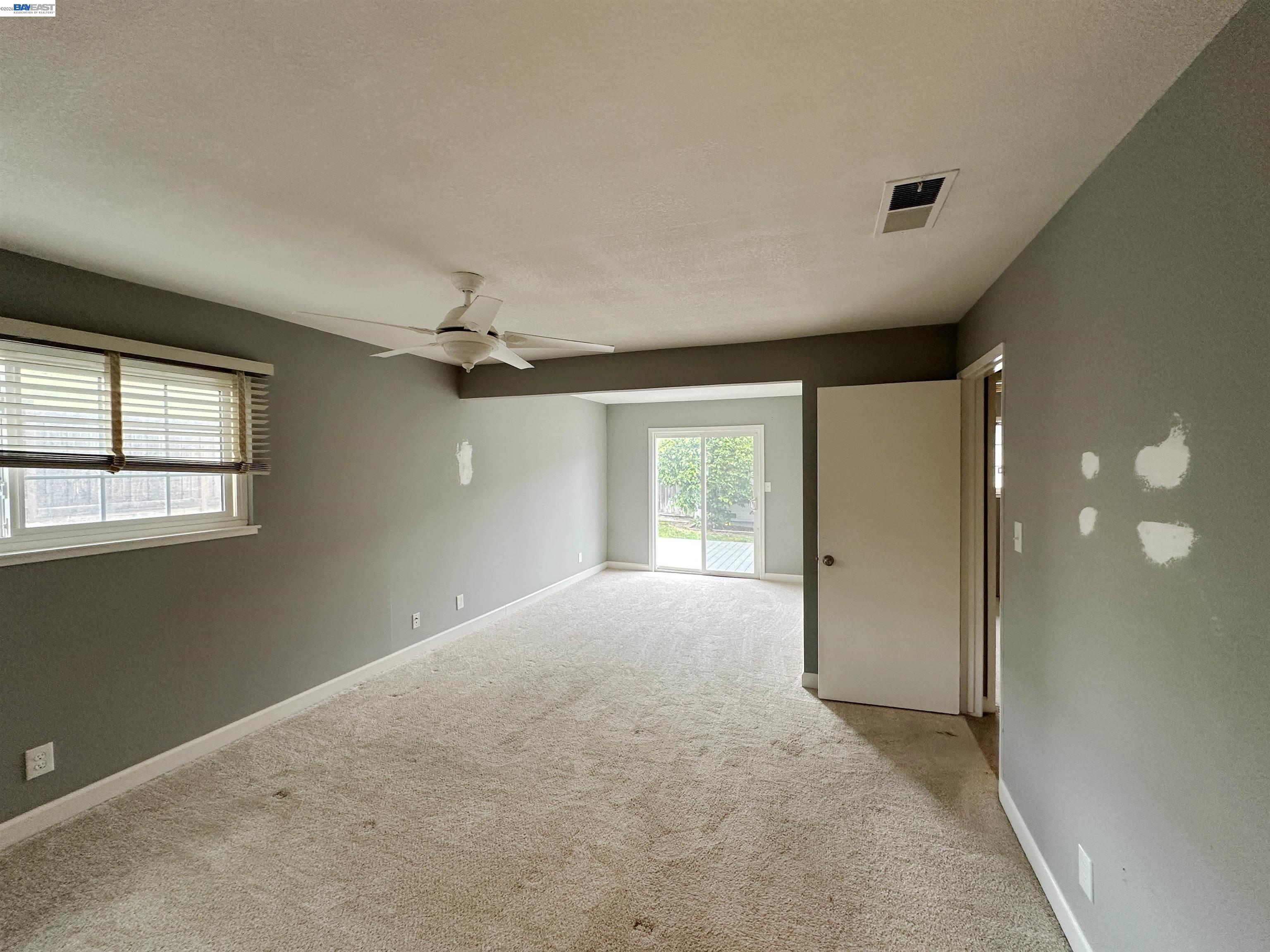 4565 Wildcat Lane Concord, CA 94521 - Photo 12 of 15 a view of a livingroom with a ceiling fan and window