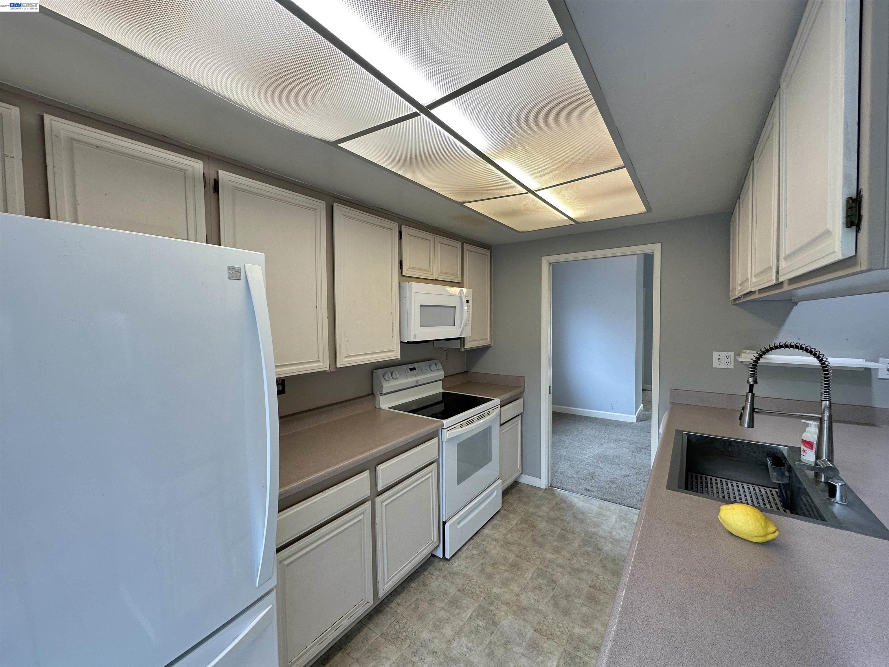 4565 Wildcat Lane Concord, CA 94521 - Photo 2 of 15 a kitchen with a sink and refrigerator