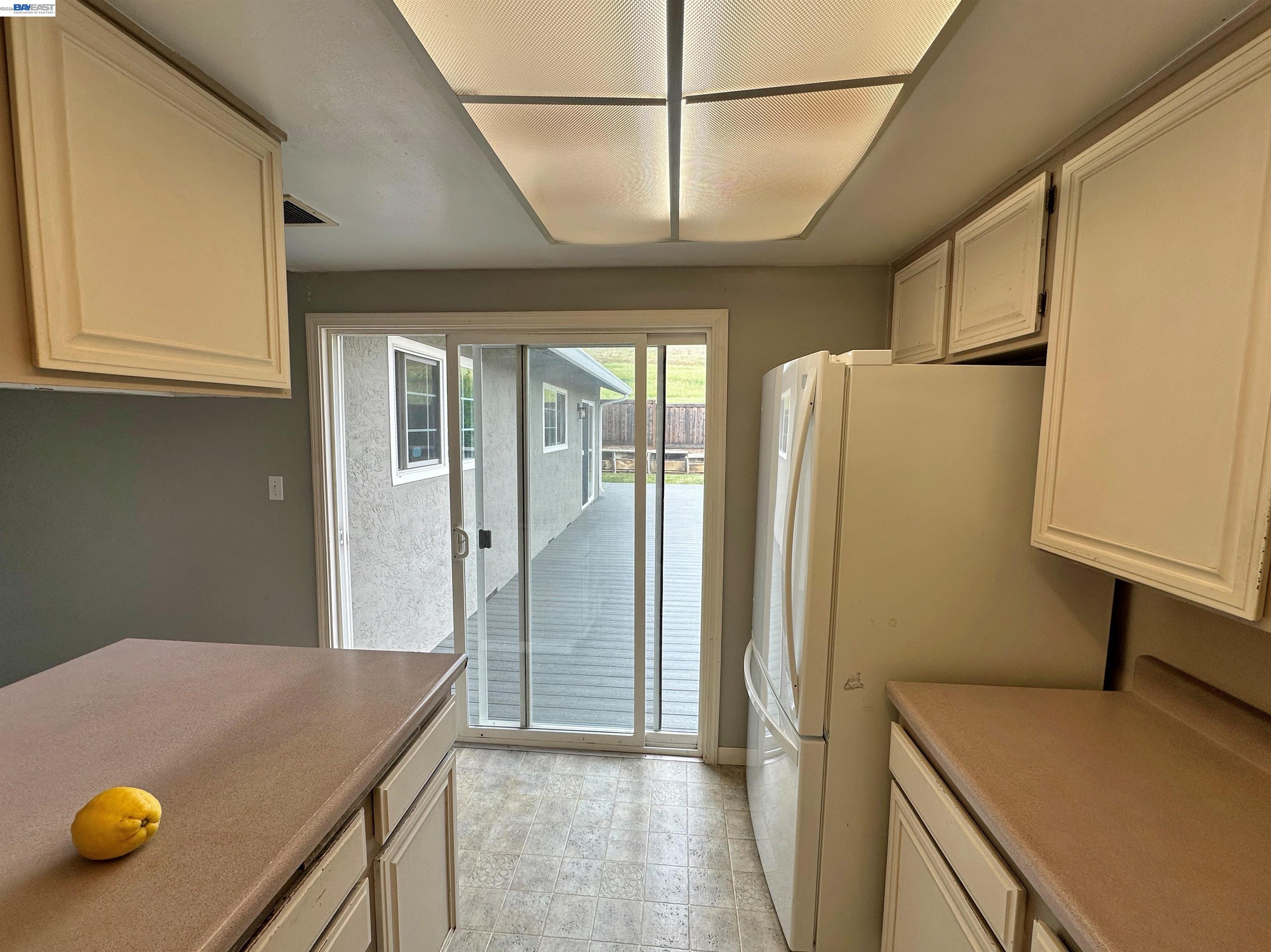 4565 Wildcat Lane Concord, CA 94521 - Photo 3 of 15 a view of a kitchen with a fridge and a sink
