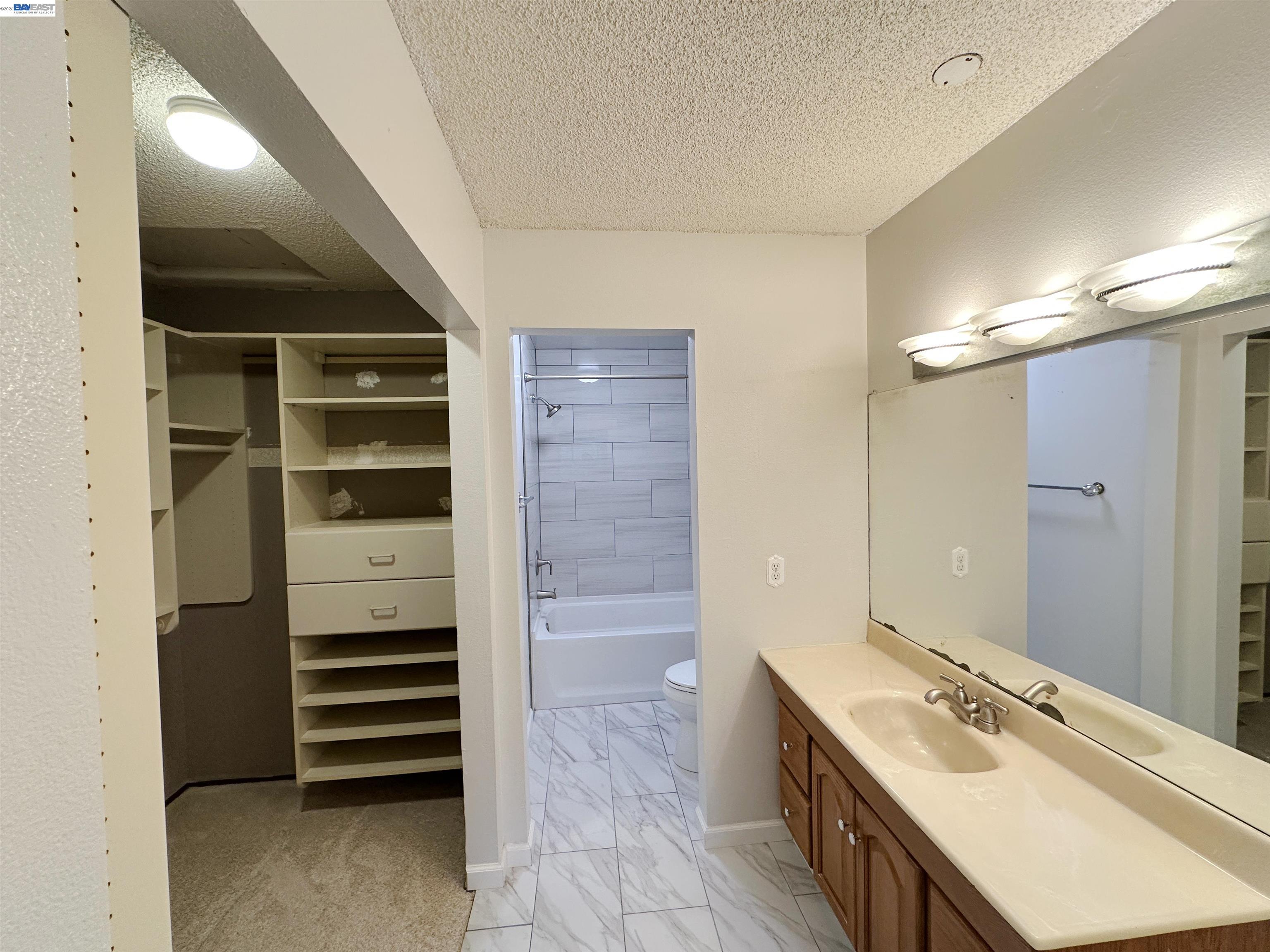 4565 Wildcat Lane Concord, CA 94521 - Photo 9 of 15 a bathroom with a tub sink and mirror