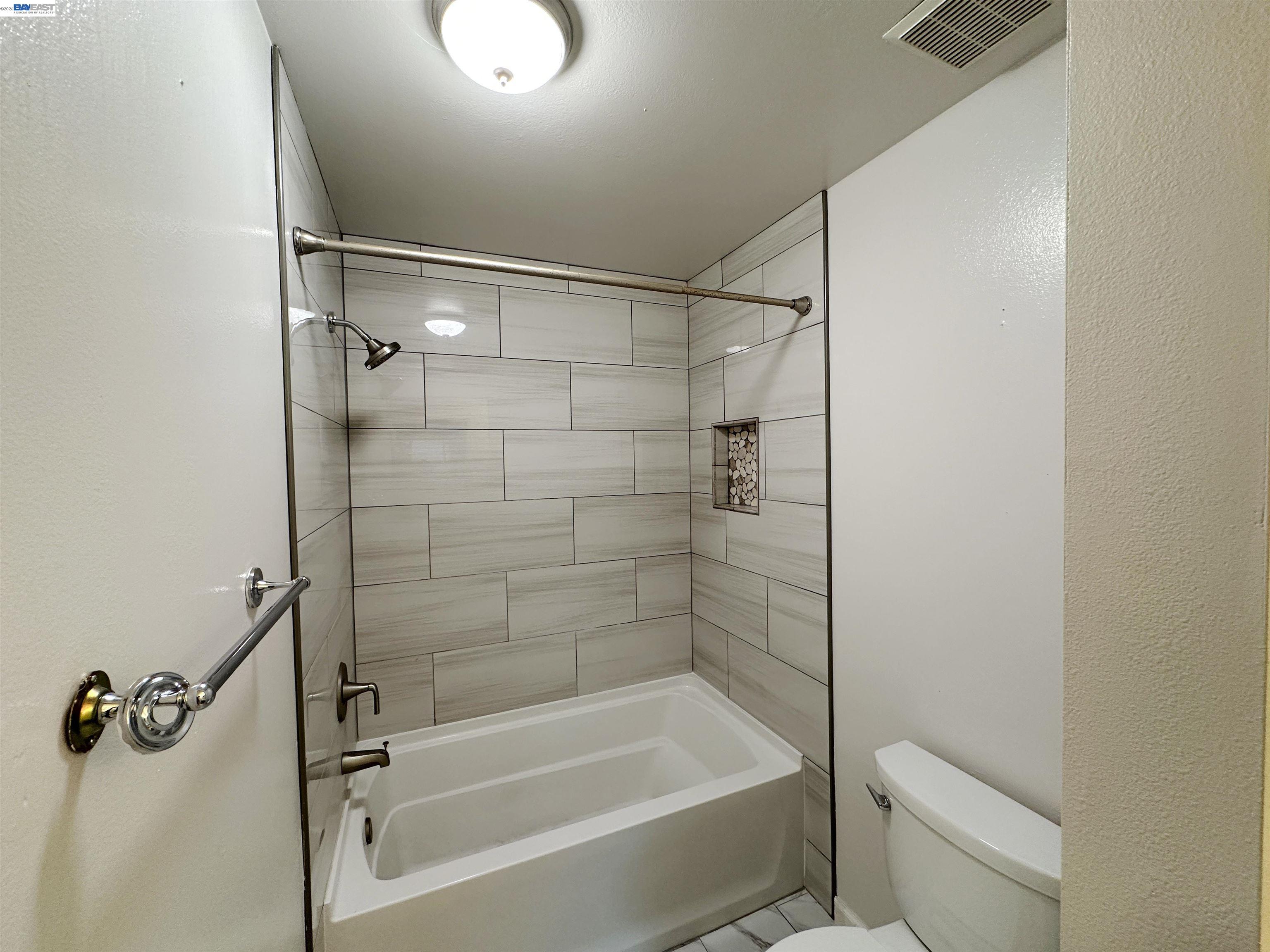 4565 Wildcat Lane Concord, CA 94521 - Photo 10 of 15 a bathroom with a shower and a toilet