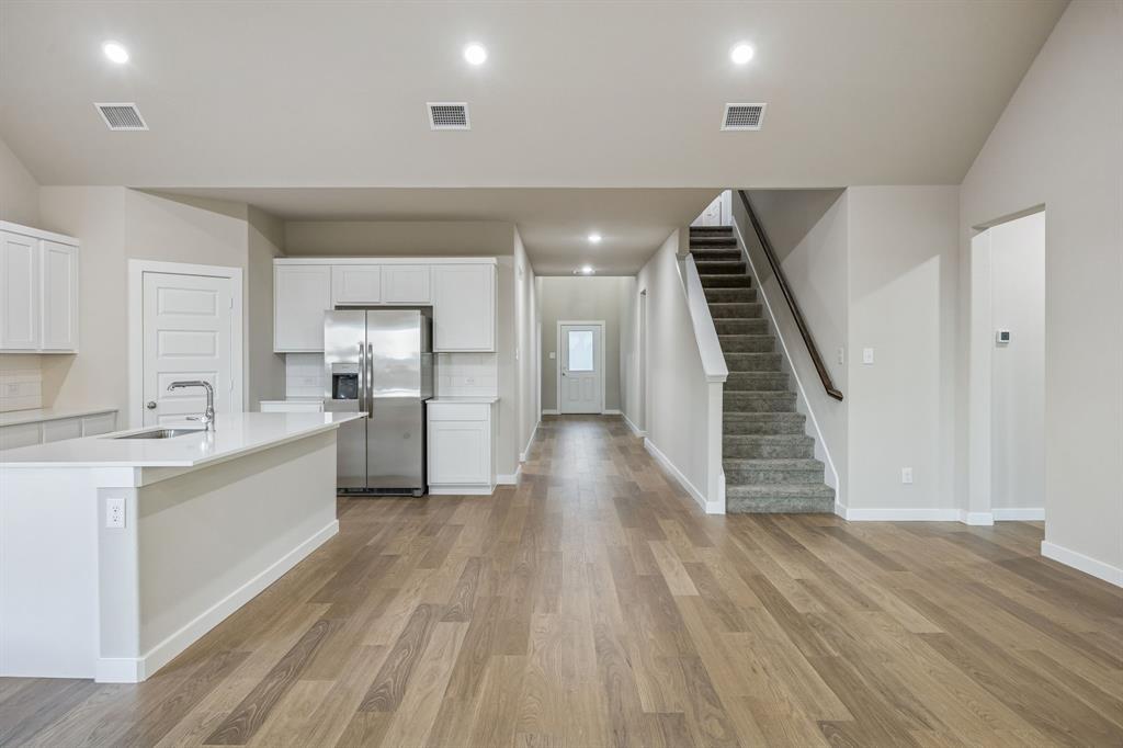 1404 Companero Street Haslet, TX 76052 - Photo 12 of 40 Open First Floor in the Wimbledon home plan by Trophy Signature Homes – REPRESENTATIVE PHOTO