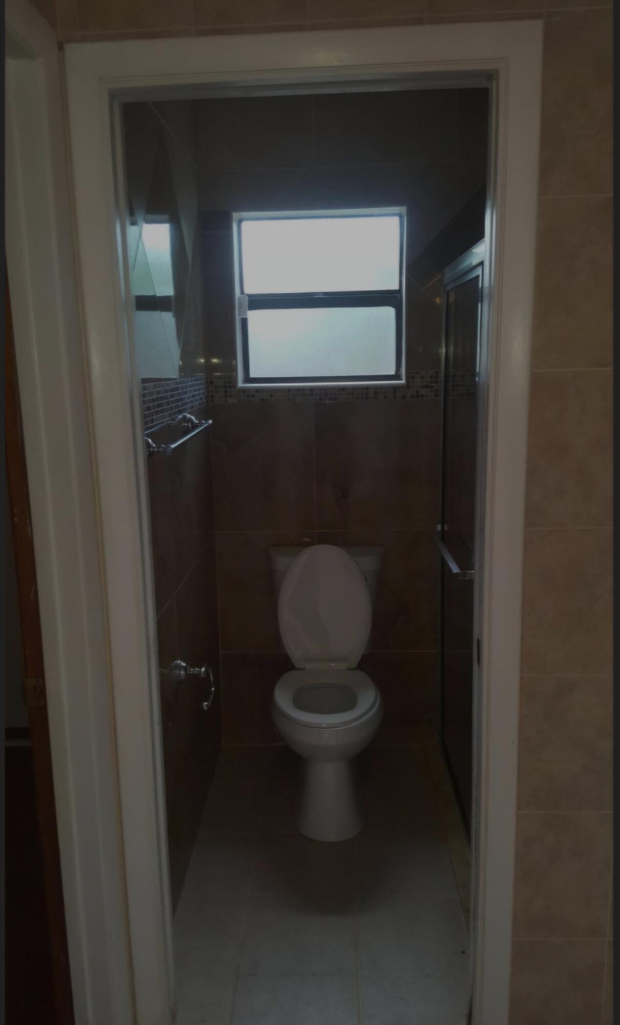 22761 Southwest 64th Way Boca Raton, FL 33428 - Photo 12 of 22 a bathroom with a toilet