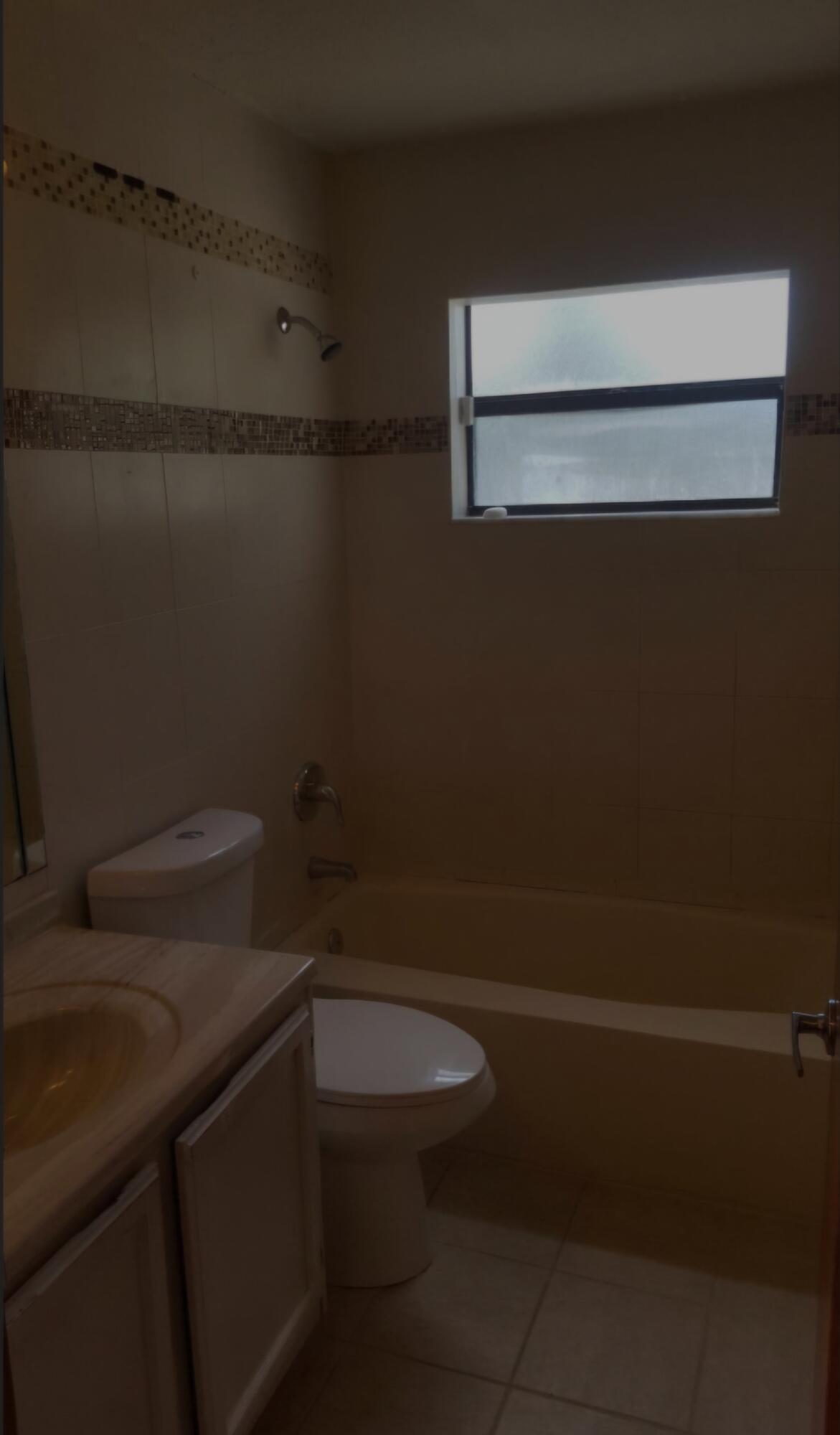 22761 Southwest 64th Way Boca Raton, FL 33428 - Photo 13 of 22 a bathroom with a toilet