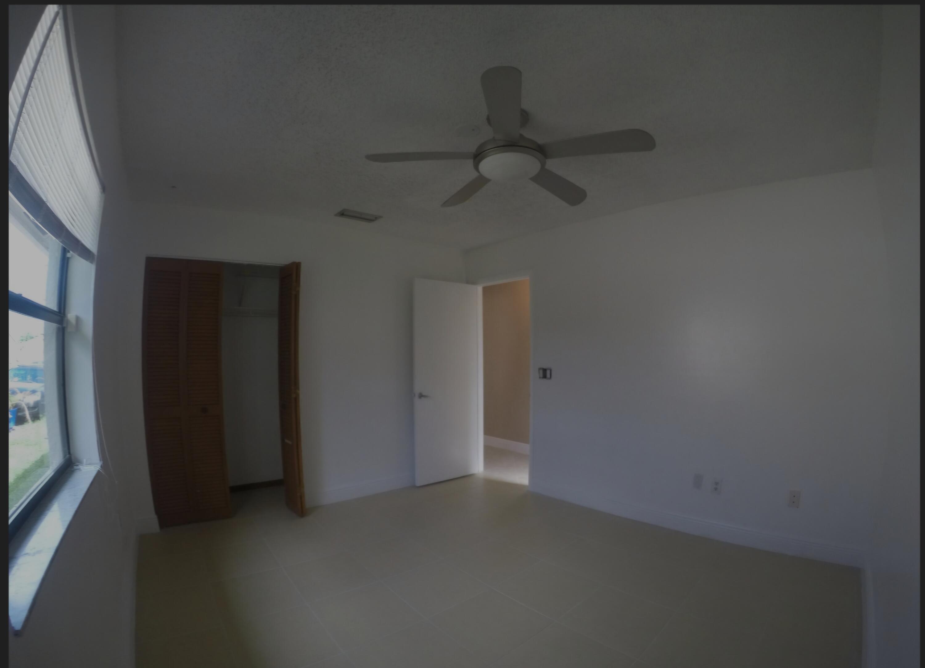 22761 Southwest 64th Way Boca Raton, FL 33428 - Photo 14 of 22 a view of empty room with windows
