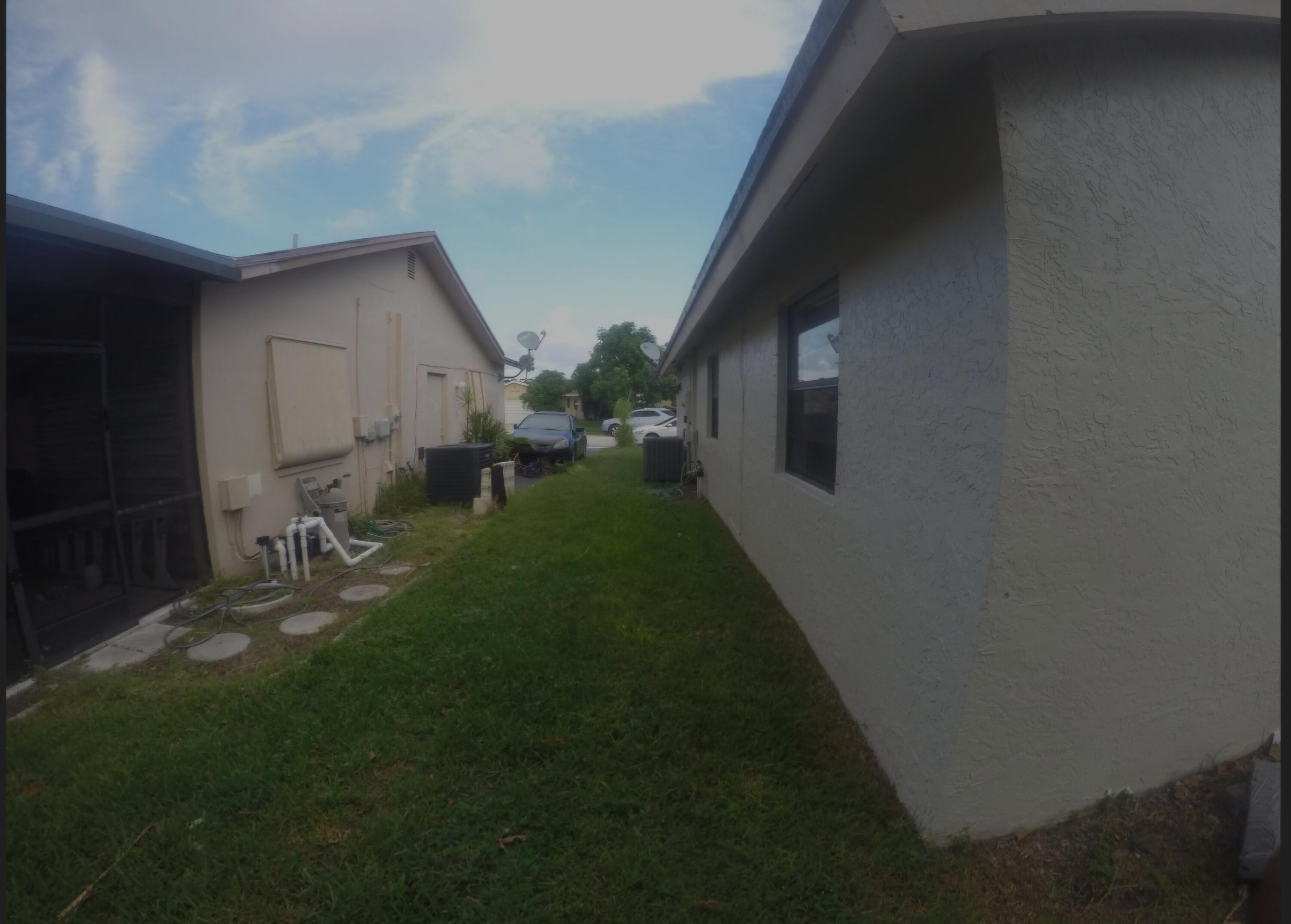 22761 Southwest 64th Way Boca Raton, FL 33428 - Photo 5 of 22 a backyard of a house with seating space
