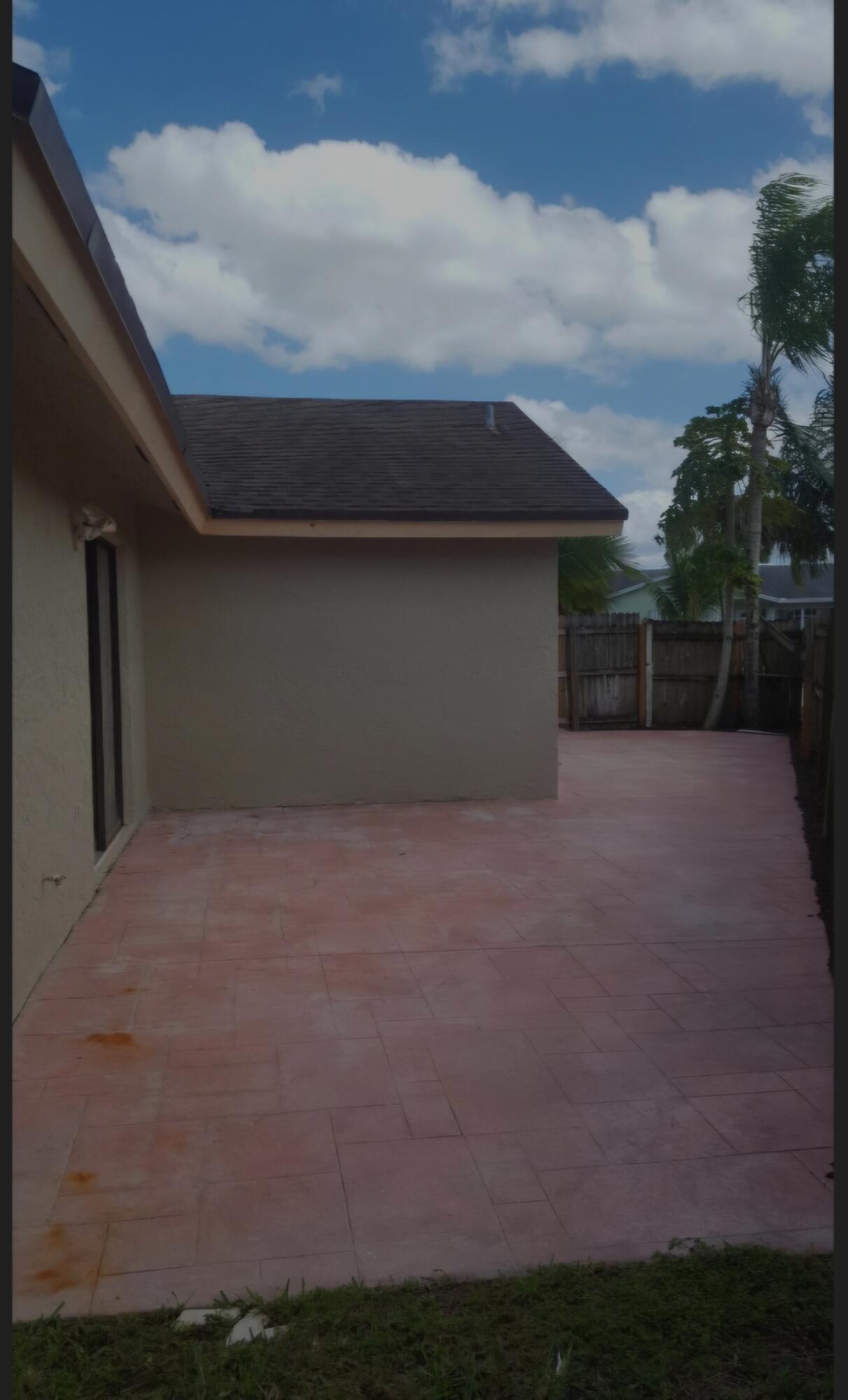 22761 Southwest 64th Way Boca Raton, FL 33428 - Photo 6 of 22 a house with outdoor space