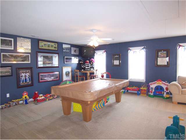 2115 Summer Shire Way Raleigh, NC 27604 - Photo 12 of 25 Upstairs is the huge, open Loft/Bonus Rm w/neutral carpet & lg closet organized for game/toy storage.