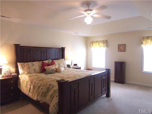 2115 Summer Shire Way Raleigh, NC 27604 - Photo 14 of 25 The BIG MBR features a tray ceiling, neutral carpet, CF, lg WIC & lg, bright Bath w/garden tub & sep shower.