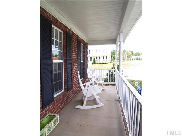 Rocking chair front porch overlooks the family-friendly n'hood.
