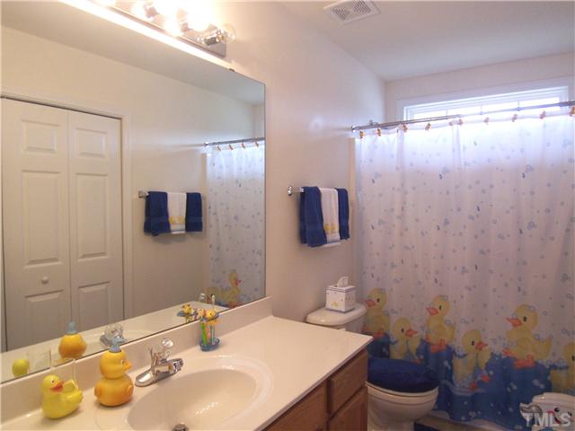2115 Summer Shire Way Raleigh, NC 27604 - Photo 20 of 25 The spacious family Bath has a convenient Laundry closet.