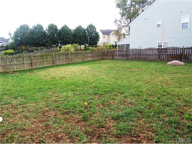 2115 Summer Shire Way Raleigh, NC 27604 - Photo 23 of 25 The spacious backyard is enclosed by a wooden fence.