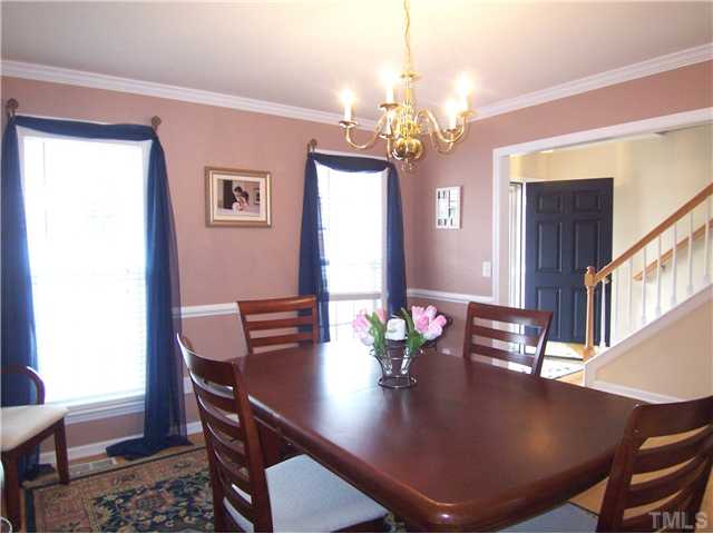 2115 Summer Shire Way Raleigh, NC 27604 - Photo 3 of 25 The spacious formal Dining Rm offers a hardwood floor and crown & chair rail molding.