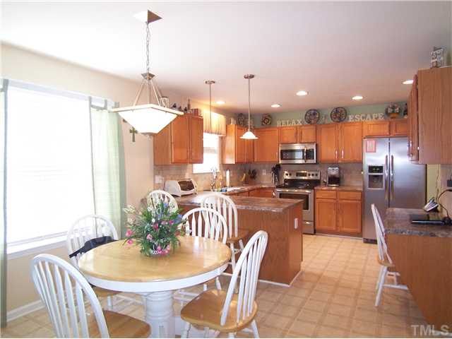 2115 Summer Shire Way Raleigh, NC 27604 - Photo 6 of 25 View of the open Kitchen & B'fast area shows the convenient desk.
