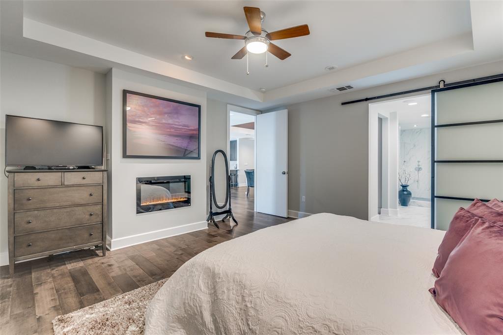 1505 Elm Street, Unit 1504 Dallas, TX 75201 - Photo 16 of 33 a bedroom with a bed and a flat screen tv