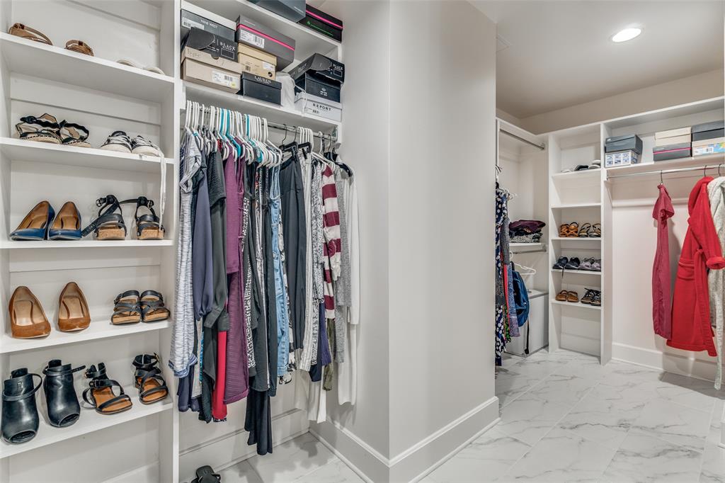 1505 Elm Street, Unit 1504 Dallas, TX 75201 - Photo 19 of 33 a view of walk in closet with clothes and shoes