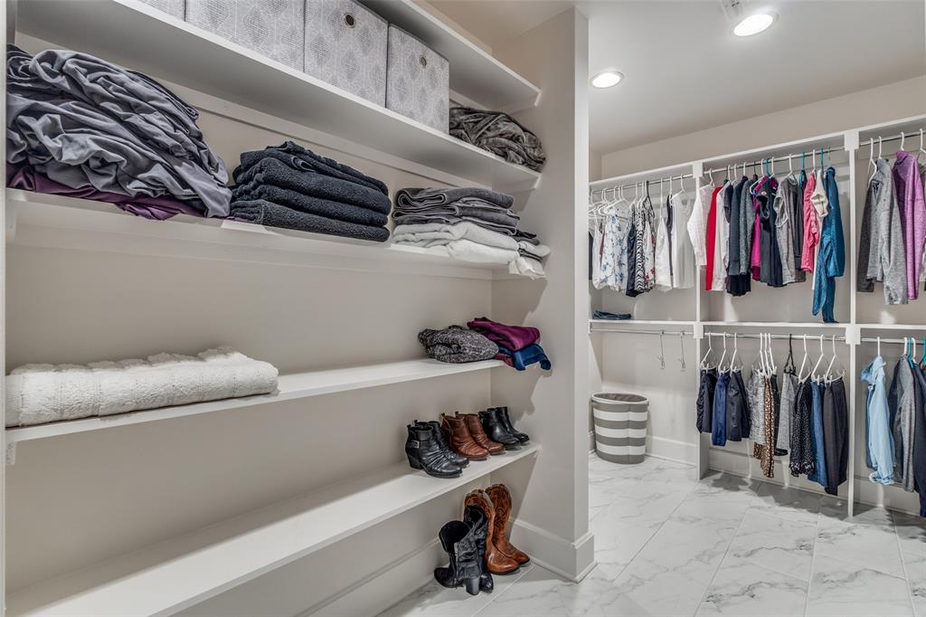 1505 Elm Street, Unit 1504 Dallas, TX 75201 - Photo 20 of 33 a view of walk in closet with clothes and shoes