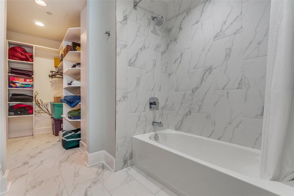 1505 Elm Street, Unit 1504 Dallas, TX 75201 - Photo 24 of 33 a bathroom with a bathtub and a shower