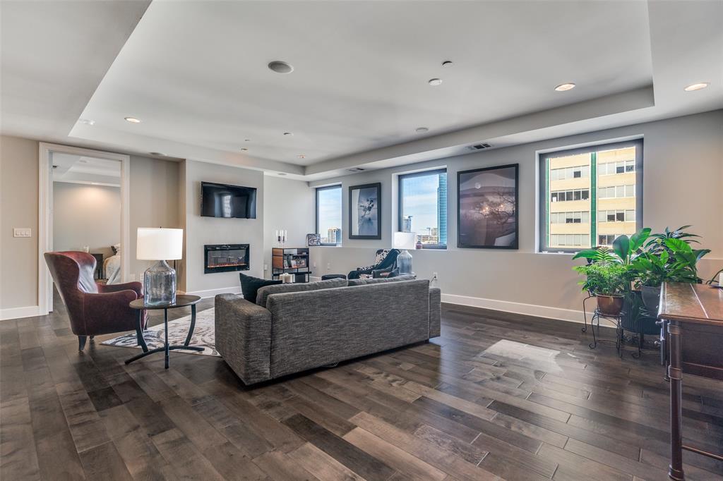 1505 Elm Street, Unit 1504 Dallas, TX 75201 - Photo 8 of 33 a living room with furniture and a fireplace