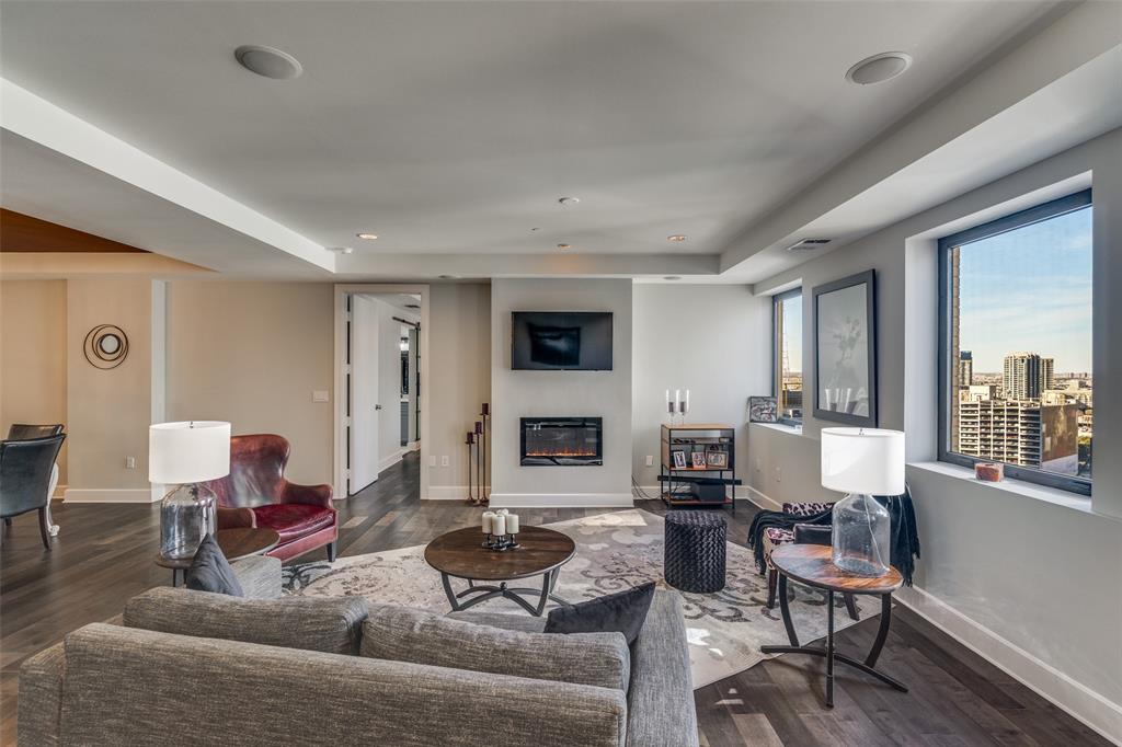 1505 Elm Street, Unit 1504 Dallas, TX 75201 - Photo 9 of 33 a living room with furniture and a large window