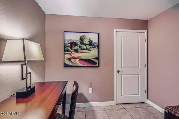a view of a room with painting on the wall