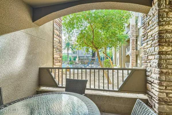 a view of balcony with furniture