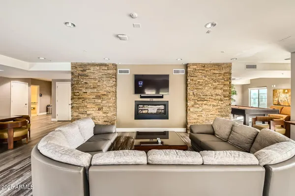a living room with furniture and a flat screen tv