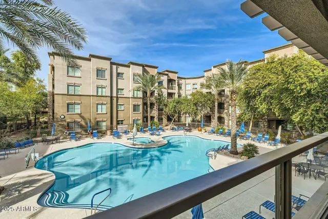 a view of swimming pool with outdoor seating