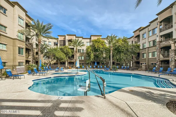 a view of a swimming pool with a patio